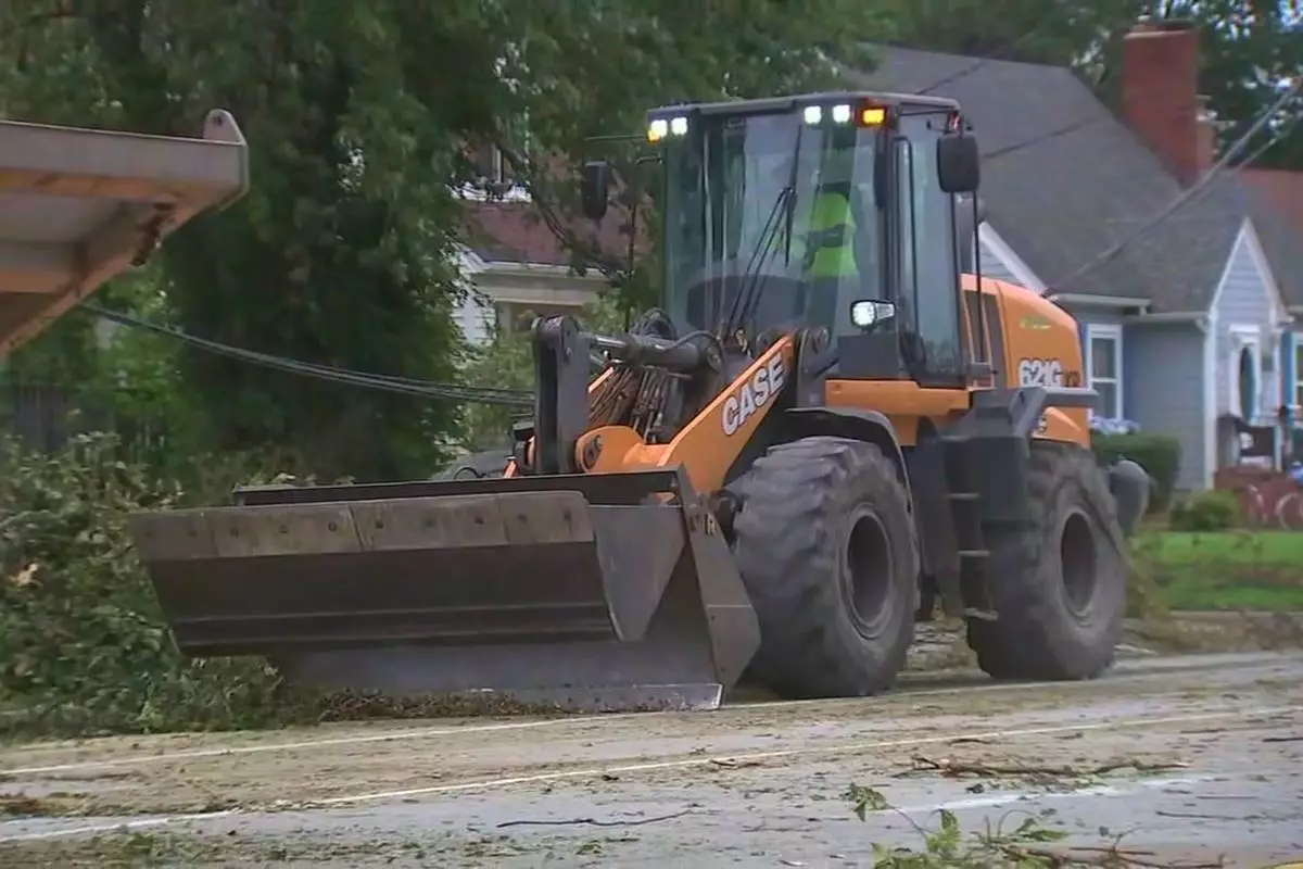 This image made from a video provided by ABC 7 Chicago shows crews working to restore power on Tuesday, Aug. 18, 2026, in Griffith, Ind., more than a week after storms leveled trees and knocked down power lines across the region. (ABC 7 Chicago via AP)