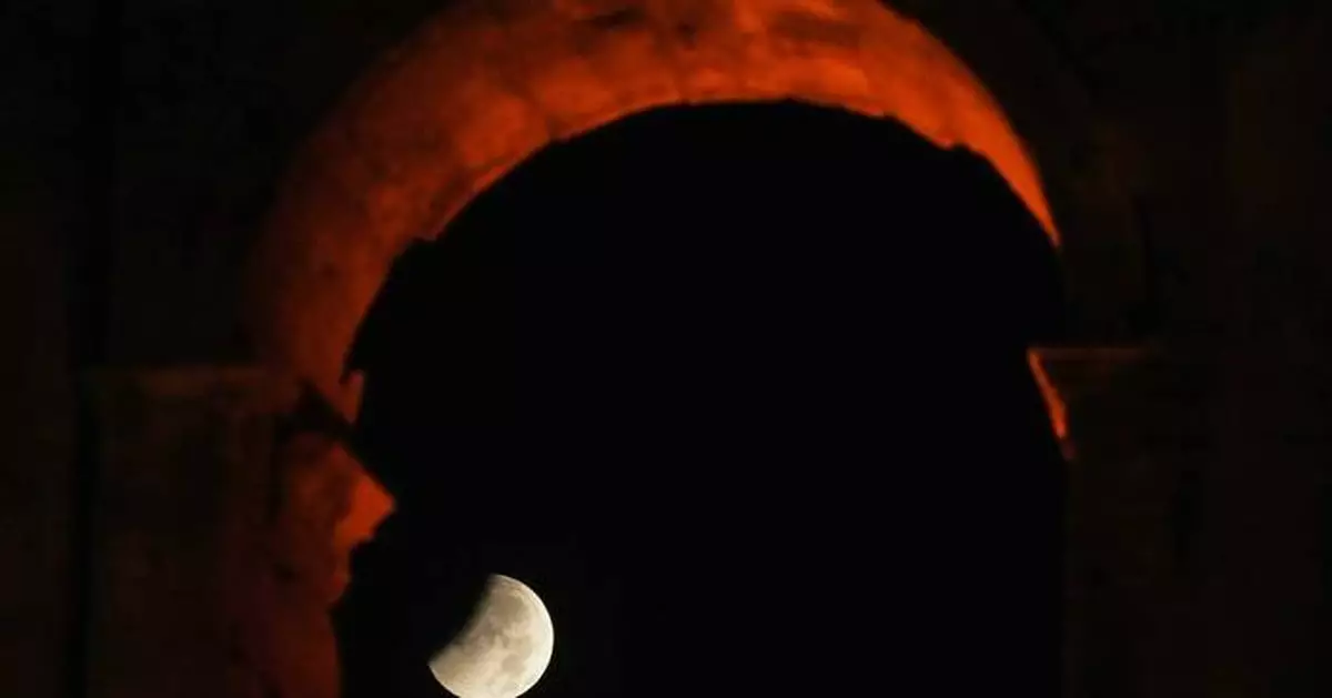 A lunar eclipse lights up skies across the Americas and Europe, in photos