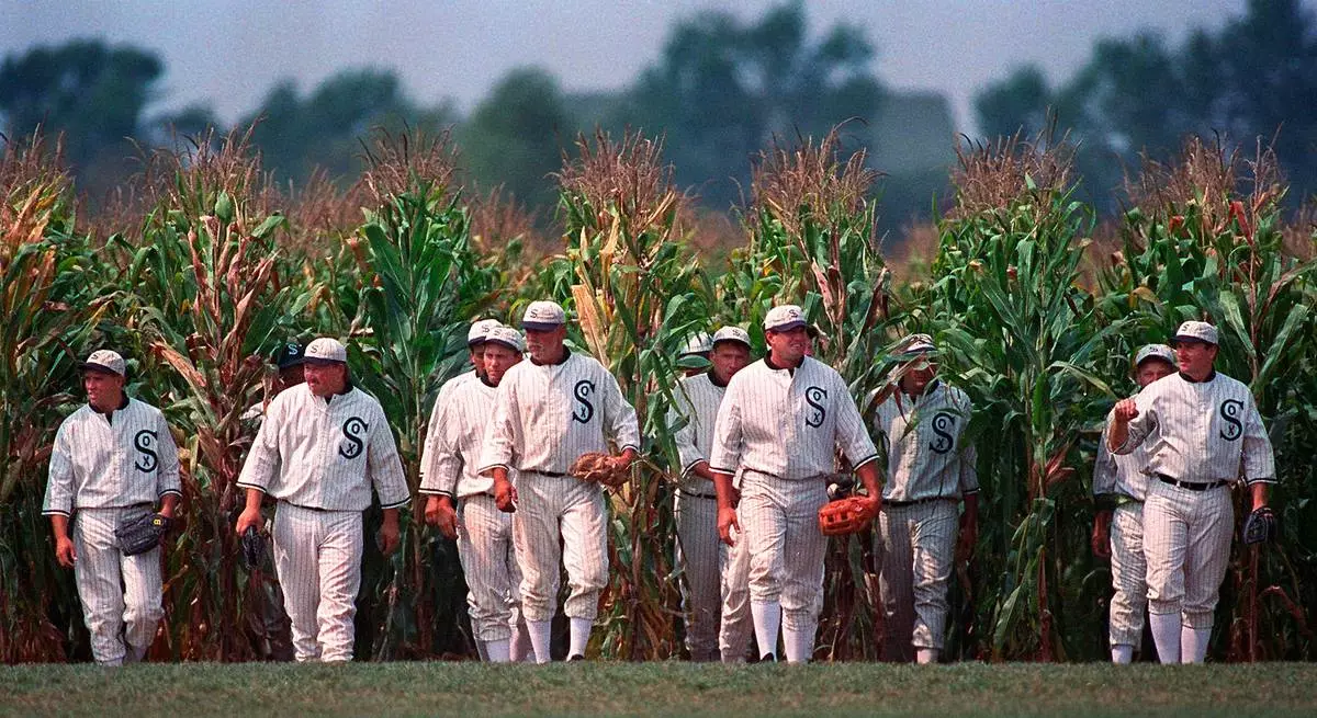 FILE - People portraying ghost players emerge from the cornfield at the "Field of Dreams" movie site in Dyersville, Iowa, on June 22, 1997. (AP Photo/Charlie Neibergall, File)