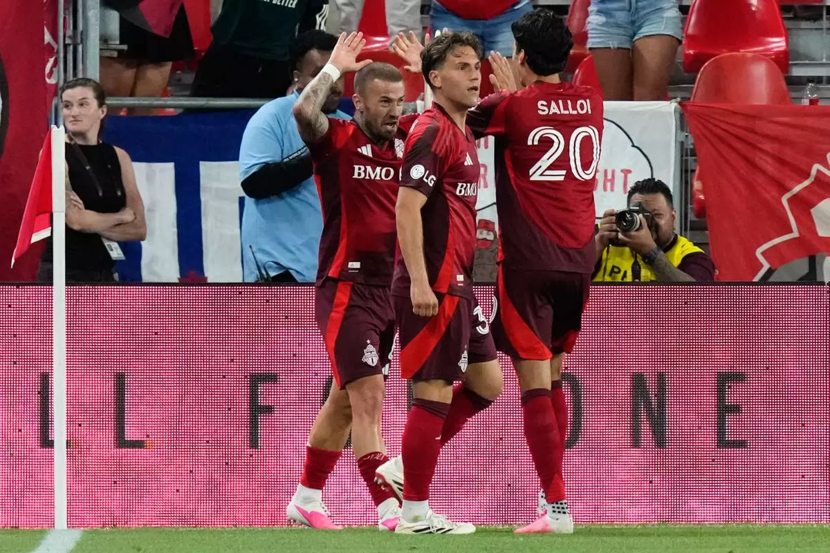 Toronto FC's Niklas Dorsch (left) celebrates with Daniel Salloi (20) and Jackson Gilman (38) after scoring against Charlotte FC during the second half of a MLS soccer game in Toronto, Wednesday, Aug. 19, 2026. (Chris Young/The Canadian Press via AP)