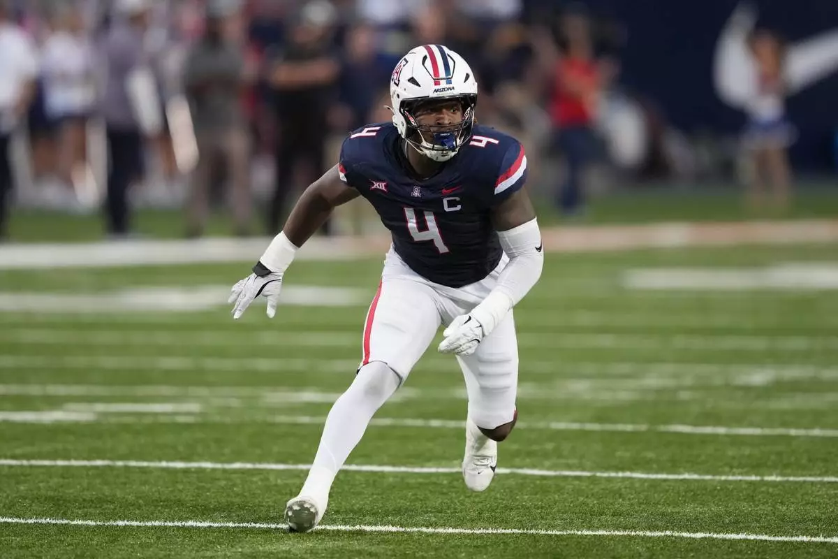 FILE - Arizona linebacker Max Harris (4) against BYU in the first half of an NCAA college football game, Saturday, Oct. 11, 2025, in Tucson, Ariz. (AP Photo/Rick Scuteri, File)