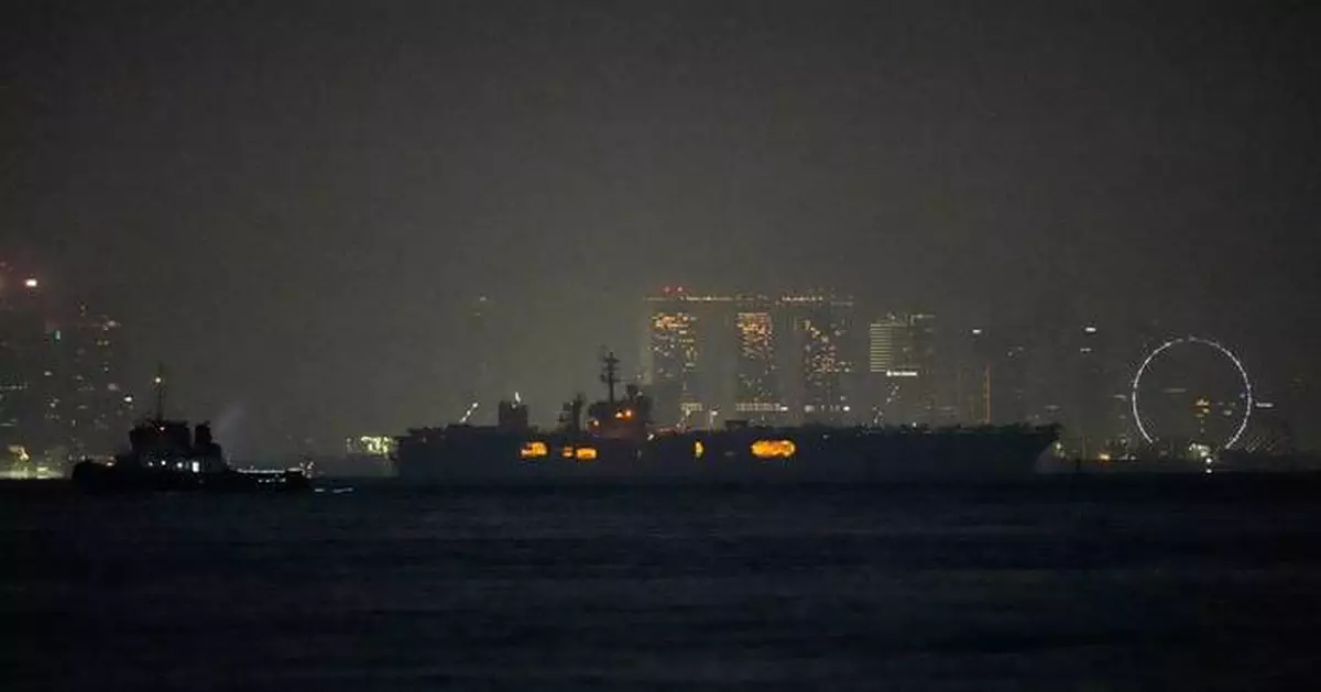 USS Abraham Lincoln sails past Singapore on its way home from Middle East