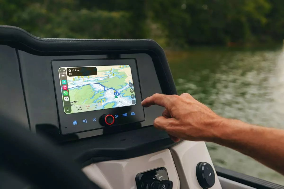 Savvy Navvy navigation displayed through Apple CarPlay at the helm of a Crest pontoon, delivering seamless on-water navigation and route planning.