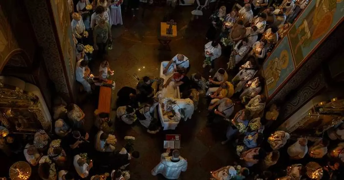 Funeral honors Ukrainian student killed as she helped the victims of a Russian strike