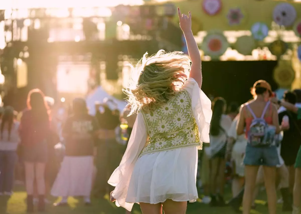 A festivalgoer dances during the band Garbage's set during the Daisy Chain Fields Music Festival on Saturday, Aug. 29, 2026, at Great Park in Irvine, Calif. (AP Photo/Chris Pizzello)