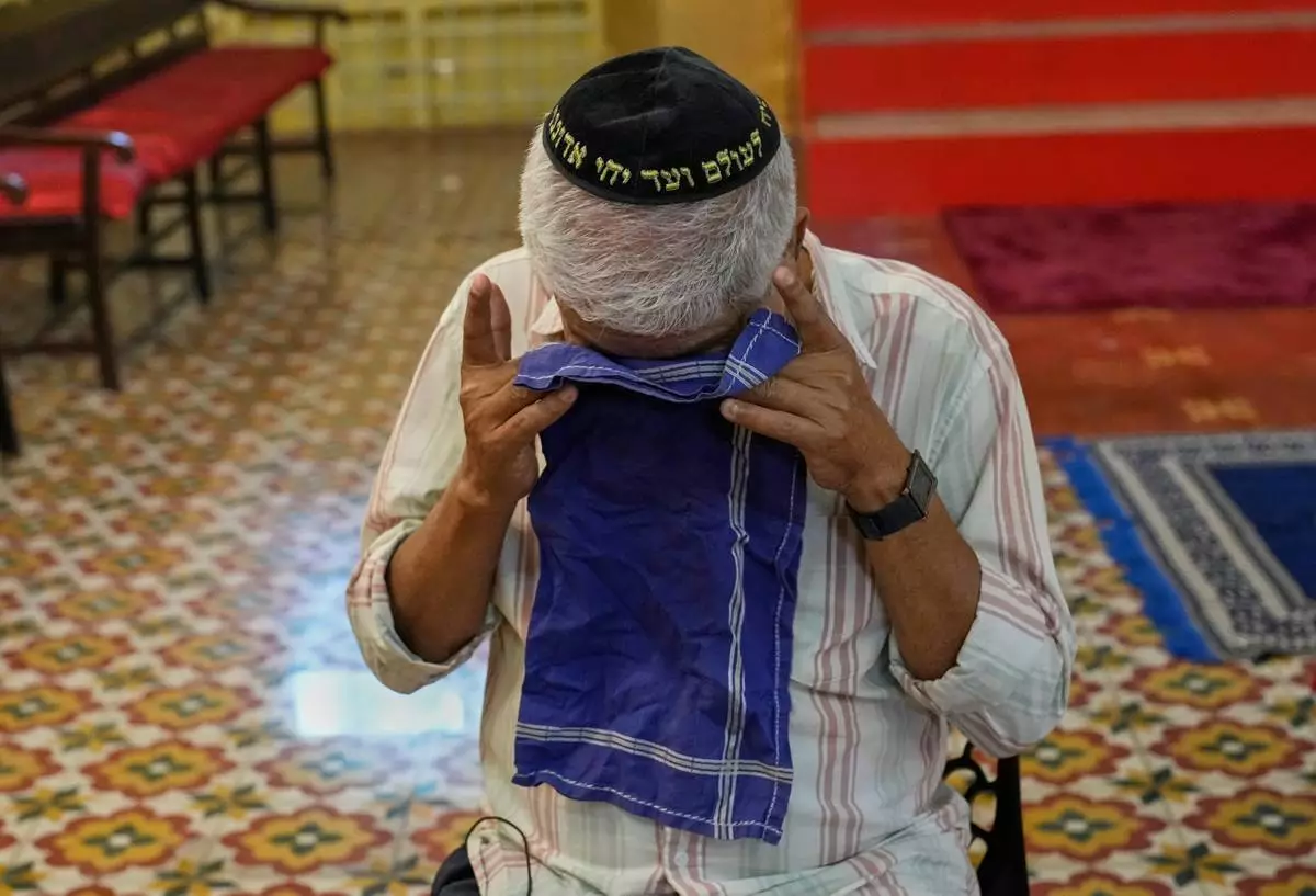 Elias Josephai, a Malabari Jew, wipes away tears while speaking to The Associated Press at the 12th-century Kadavumbagam Synagogue in Ernakulam, mainland district of Kochi, India, Thursday, May 21, 2026. (AP Photo/Aijaz Rahi)
