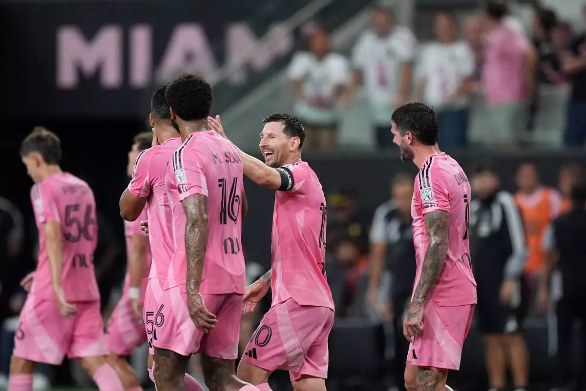 Inter Miami forward Lionel Messi (10) celebrates with teammates after scoring his side's third goal during the first half of a Leagues Cup soccer match against Atletico de San Luis, Wednesday, Aug. 5, 2026, in Miami. (AP Photo/Rebecca Blackwell)