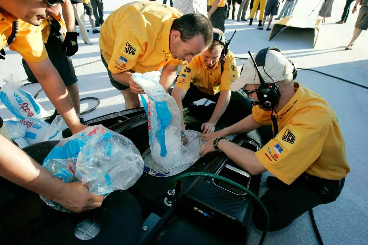 FILE - Bags of ice are loaded into the vehicle by crew members to act as a radiator before British driver Andy Green set a new unofficial world diesel powered land speed record of over 328 mph over two runs Tuesday, Aug. 22, 2006, on the Bonneville Salt Flats of Utah. (AP Photo/Douglas C. Pizac,File)