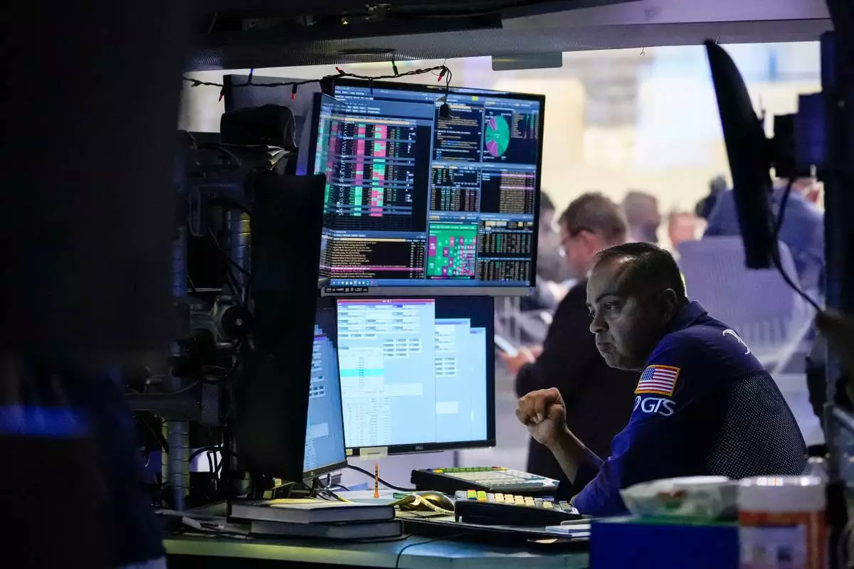 Specialist Dilip Patel works on the floor of the New York Stock Exchange, Thursday, July 30, 2026, in New York. (AP Photo/Yuki Iwamura)