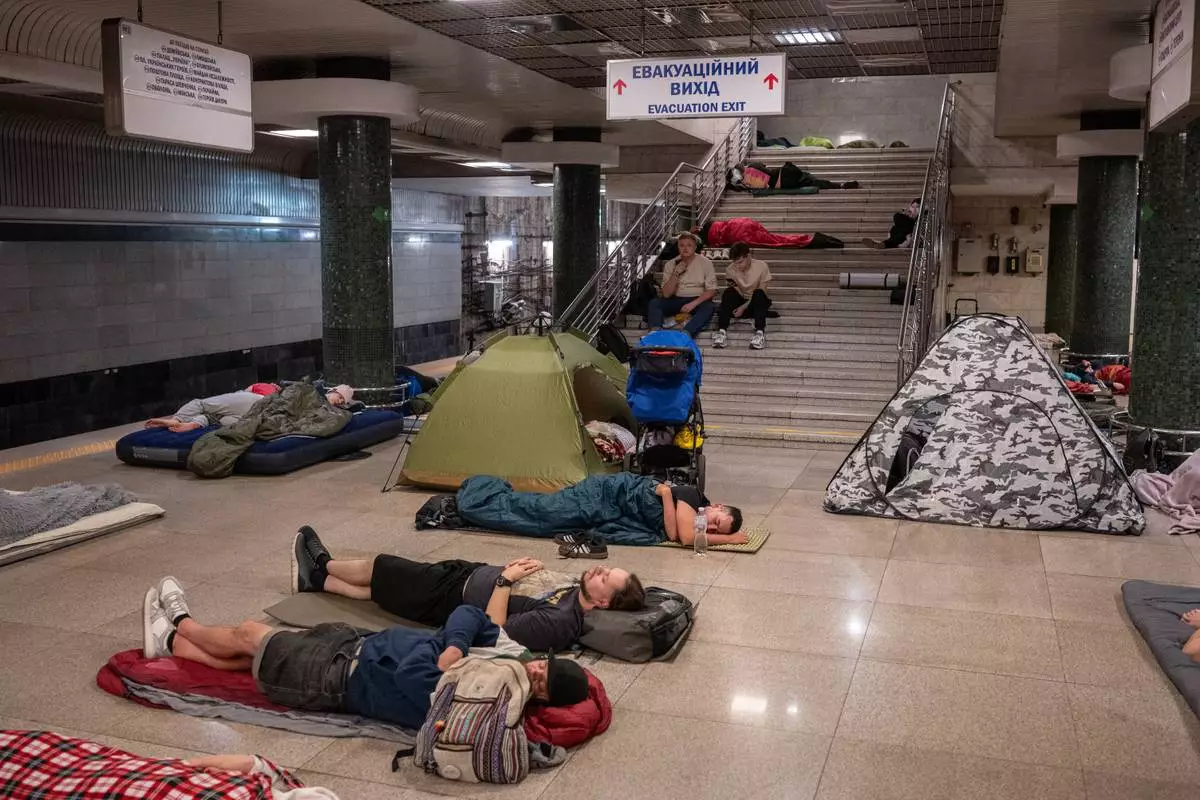 People take shelter in a metro station during a night Russian attack, in Kyiv, Ukraine, early Thursday, Aug. 20, 2026. (AP Photo/Danylo Antoniuk) CORRECTION: photographer's name corrected to Danylo Antoniuk instead of Dan Bashakov