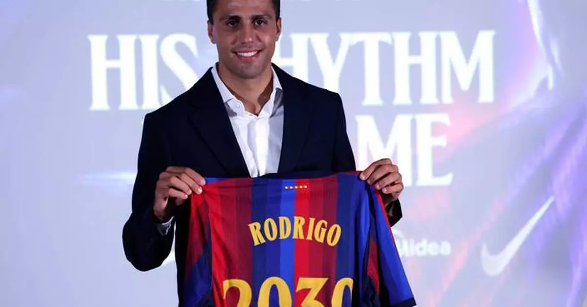 Rodri arrives hailing Barcelona's soccer values after a 'tough decision' to leave Man City