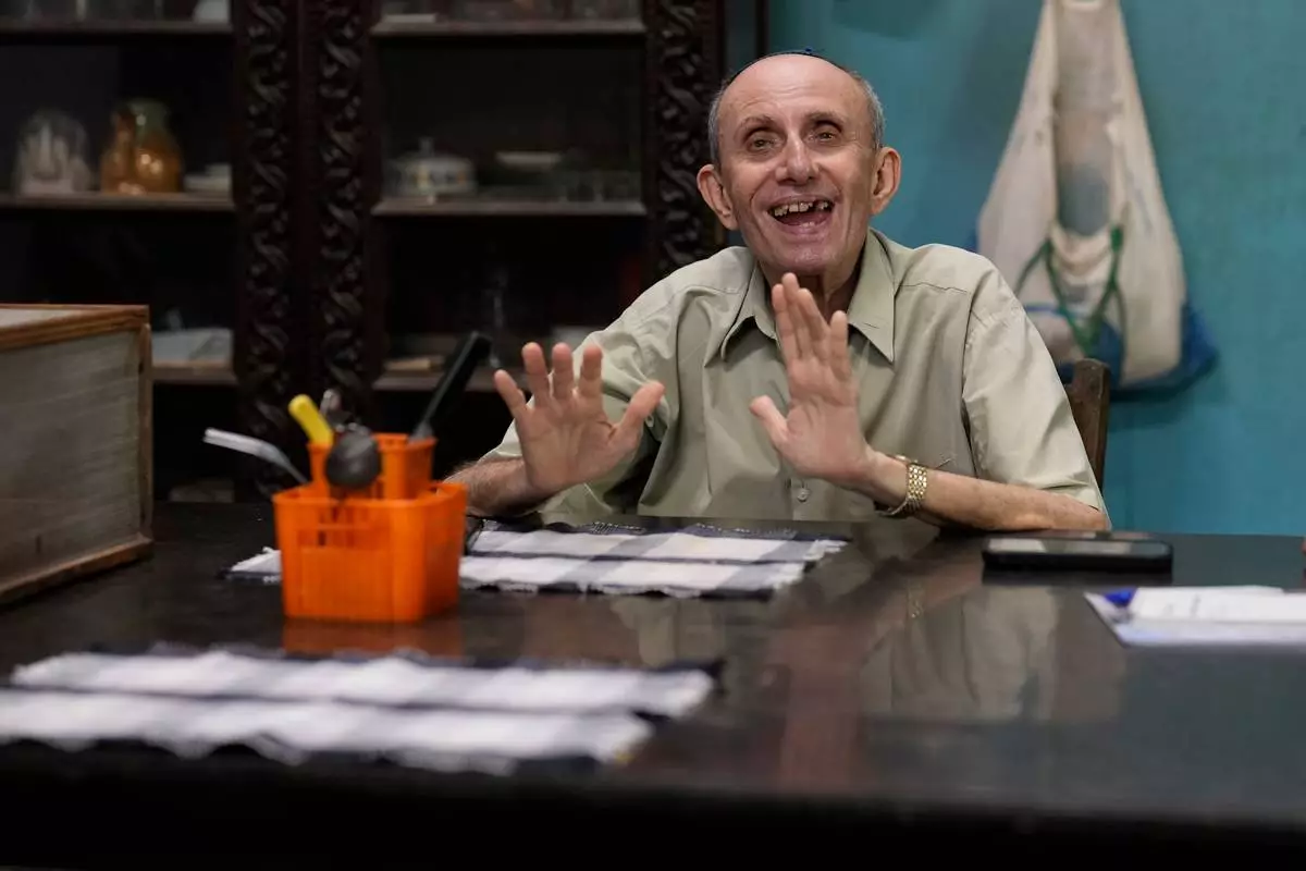 Keith Hallegua, a Paradesi Jew, speaks to The Associated Press at his home in the historic Jew Town neighborhood of Kochi, India, Wednesday, May 20, 2026. (AP Photo/Aijaz Rahi)