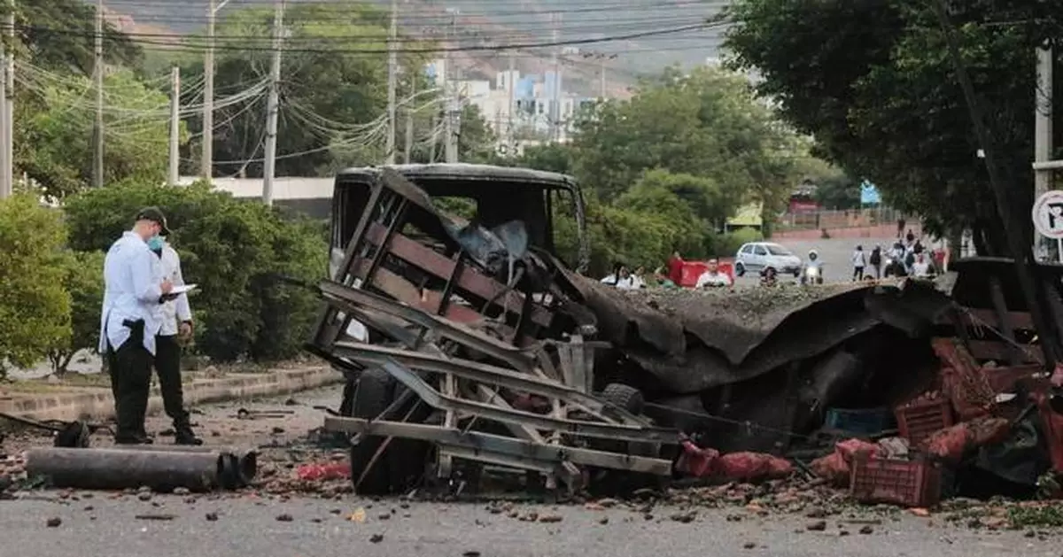 Truck explodes outside Colombia police base, injuring 11 officers and killing a dog