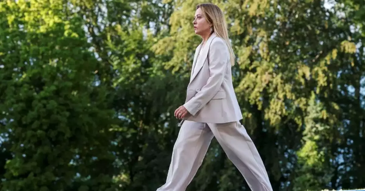 From black boots to pastel suits, Italian premier's wardrobe evolves with her politics