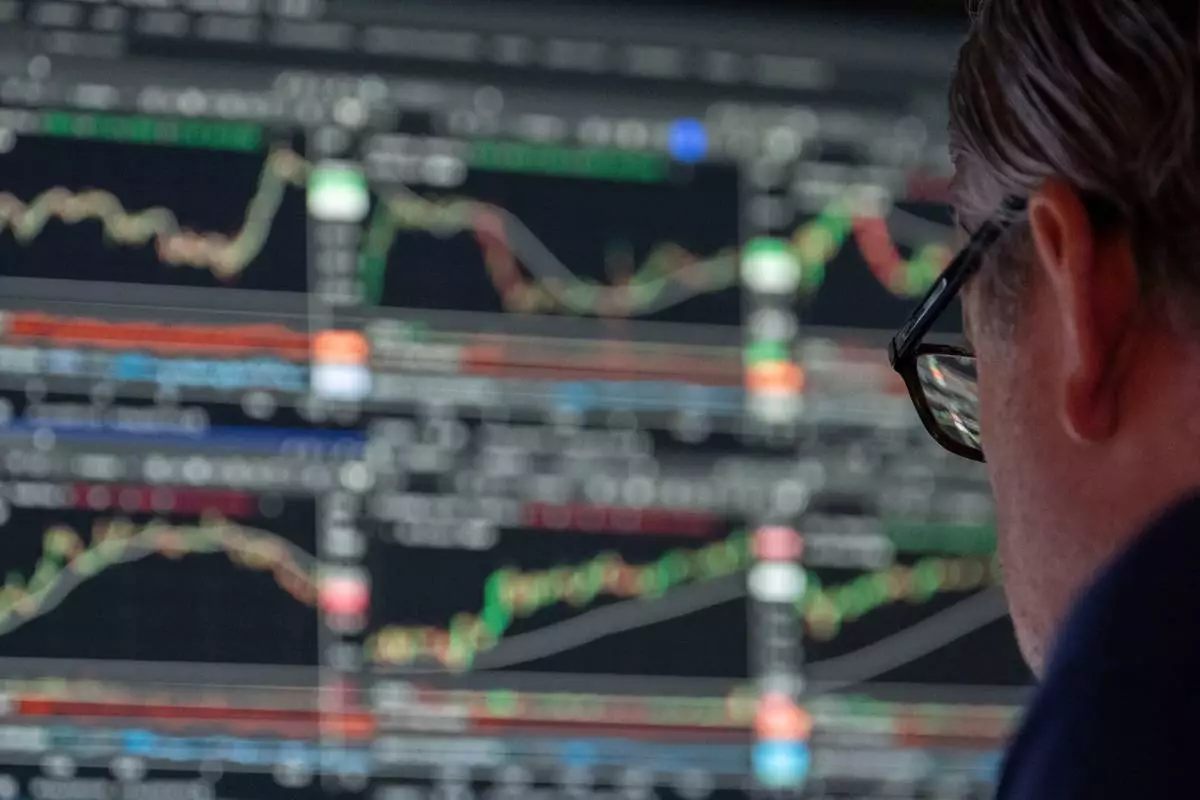 Specialist Gregg Maloney works on the floor of the New York Stock Exchange, Friday, Aug. 7, 2026, in New York. (AP Photo/Yuki Iwamura)