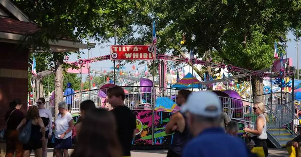 Spinning and dipping, Minnesota fairgoers delight in the classic Tilt-A-Whirl ride as it turns 100
