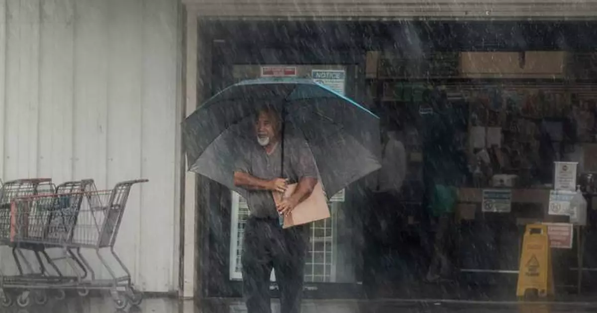 Lala is again a tropical storm, sending drenching rain and winds across the Hawaiian islands
