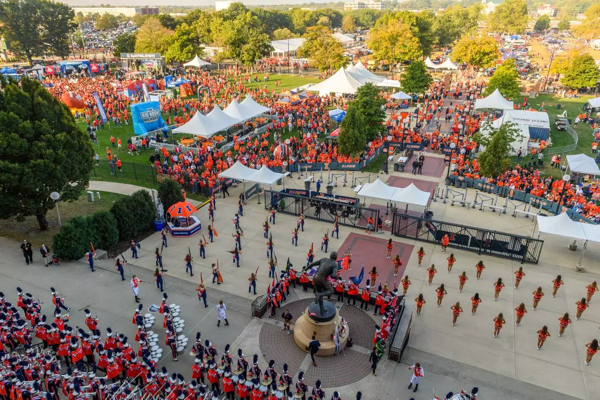 FILE - A general view of tailgating outside of Illinois' Gies Memorial Stadium prior to an NCAA college football game between Ohio State and Illinois, Oct. 11, 2025, in Champaign, Ill. (AP Photo/Craig Pessman, File)