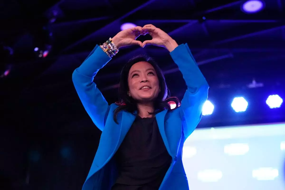 Democratic gubernatorial candidate Francesca Hong makes a heart gesture to supporters after speaking during a primary election night watch party Tuesday, Aug. 11, 2026, in Madison, Wis. (AP Photo/Nam Y. Huh)