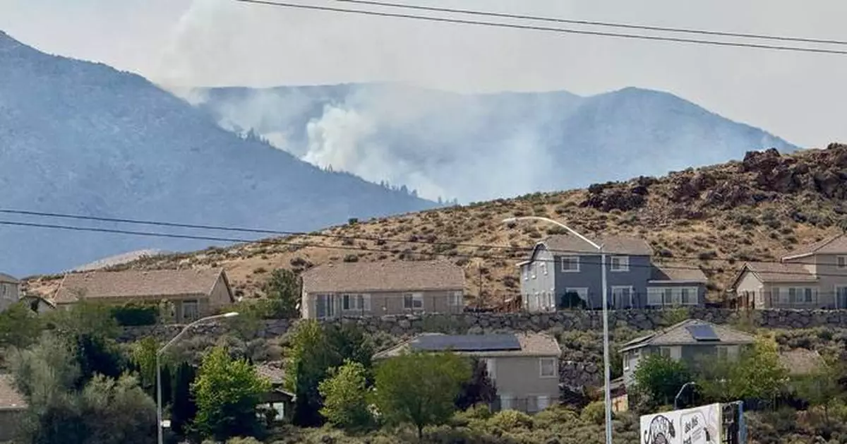 Firefighters are trying to stop a fast-moving Nevada wildfire from spreading to homes in Reno