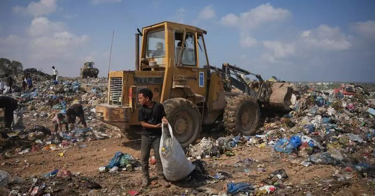 Palestinians in Gaza scavenge trash for things to burn to cook meals, in photos