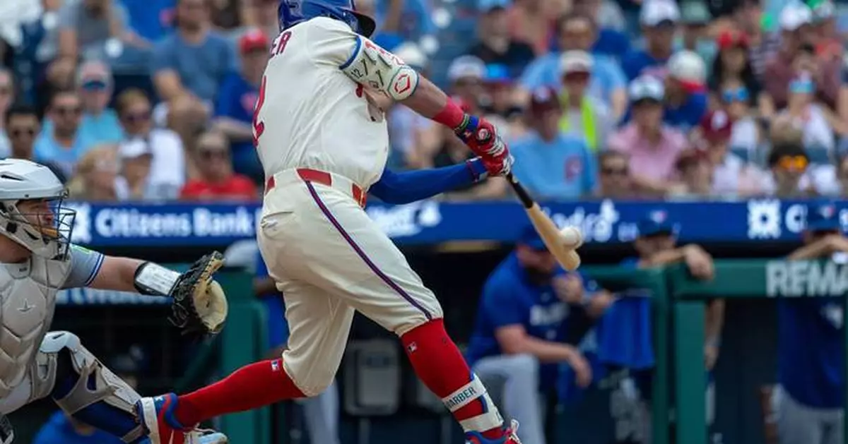 Schwarber hits 2 HRs, Hill delivers RBI single in 12th inning as Phillies beat Blue Jays 7-6