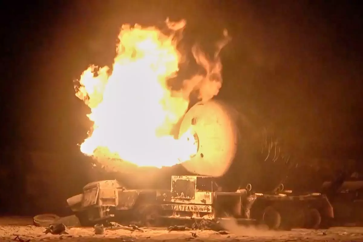FILE - In this photo taken from video released by Al Masirah TV channel shows a burning oil tanker after U.S. airstrikes targeted the Ras Isa oil port held by Yemen's Houthi rebels in Hodeida, Yemen, April 18, 2025.( Al Masirah TV via AP, File)