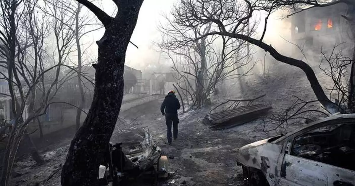 Belgian wildfire approaches Germany as Greece probes deadly blaze
