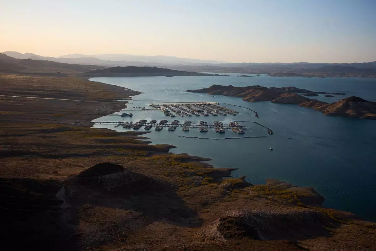 FILE - Boats are moored at a marina on Lake Mead amid a droughtnat the Lake Mead National Recreation Area near Boulder City, Nev., June 30, 2026. (AP Photo/John Locher, File)