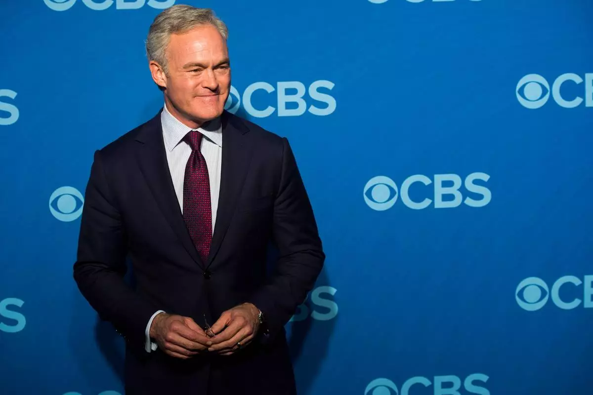 FILE - Scott Pelley, anchor of "CBS Evening News," poses in New York, May 15, 2013. (Photo by Charles Sykes/Invision/AP, File)