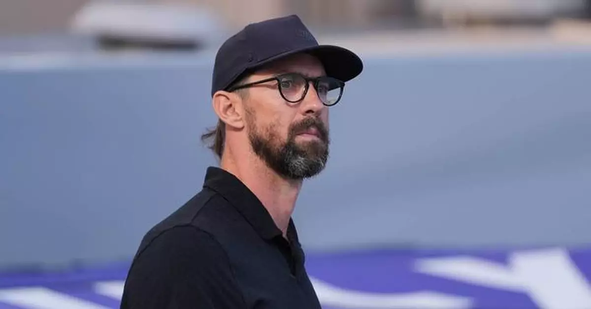 Michael Phelps returns poolside with his sons as 8-year-old Beckett eyes swimming