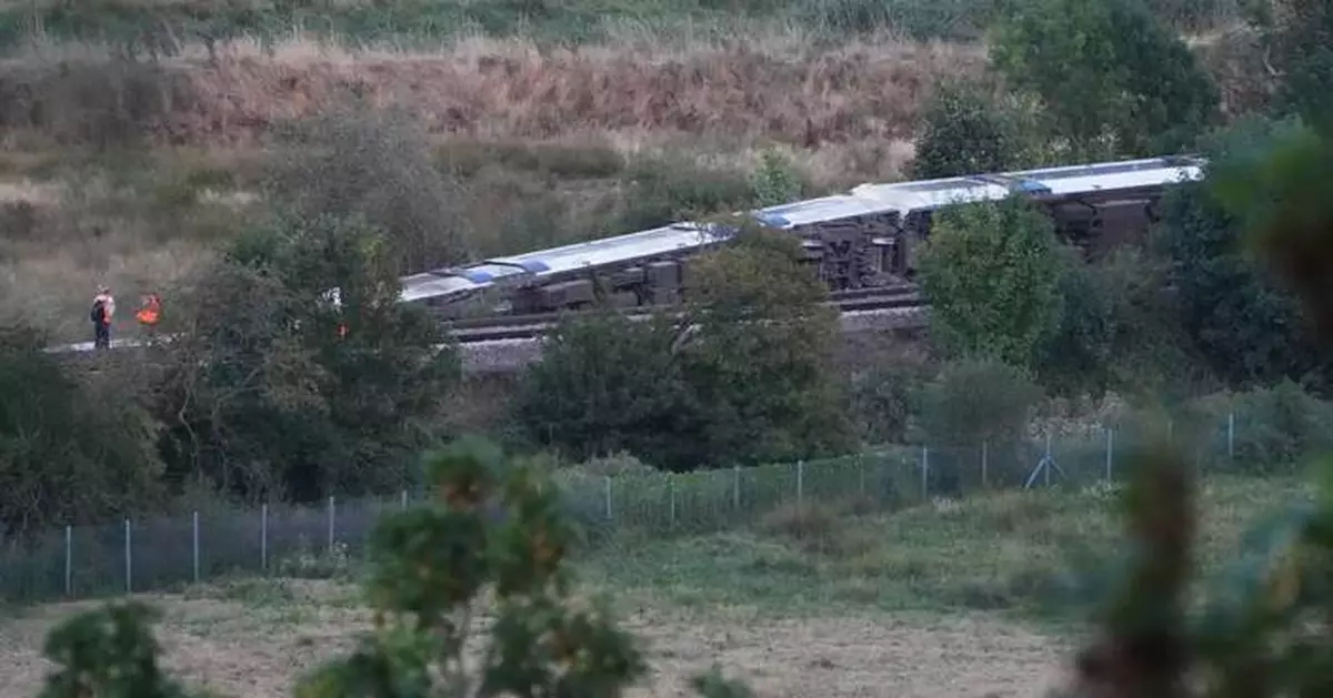 Passenger train derails and 11 people injured after carriages overturn in southern England