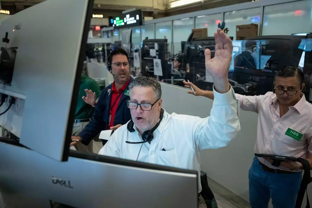 Options trader Marty Handler works on the floor of the New York Stock Exchange, Thursday, Aug. 27, 2026, in New York. (AP Photo/Yuki Iwamura)
