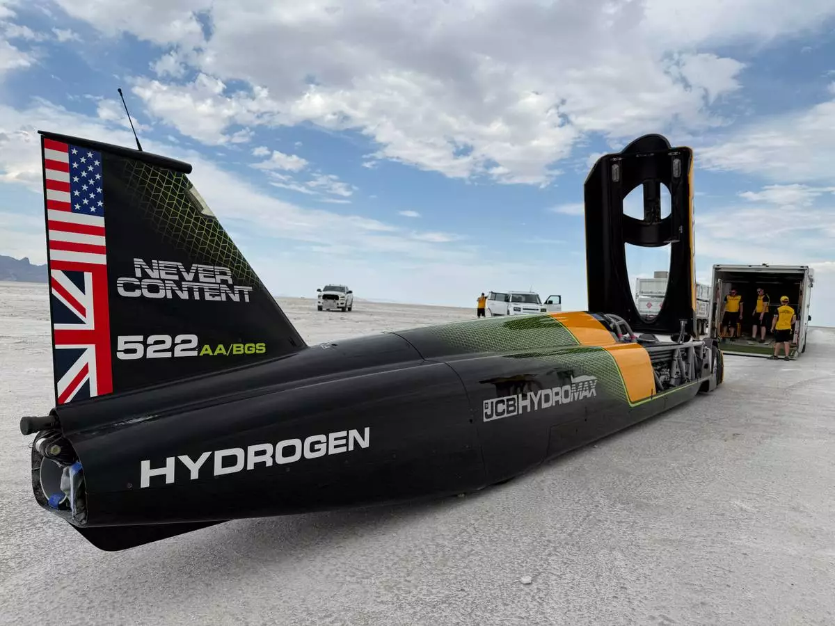 The JCB Hydromax sits on the Bonneville Salt Flats in Wendover, Utah, where Andy Green aims to drive it to a land speed record for cars powered by hydrogen internal combustion engines, Monday, Aug. 10, 2026. (AP Photo/Hannah Schoenbaum)