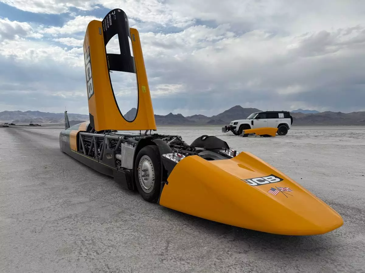 The JCB Hydromax sits on the Bonneville Salt Flats in Wendover, Utah, where Andy Green aims to drive it to a land speed record for cars powered by hydrogen internal combustion engines, Monday, Aug. 10, 2026. (AP Photo/Hannah Schoenbaum)