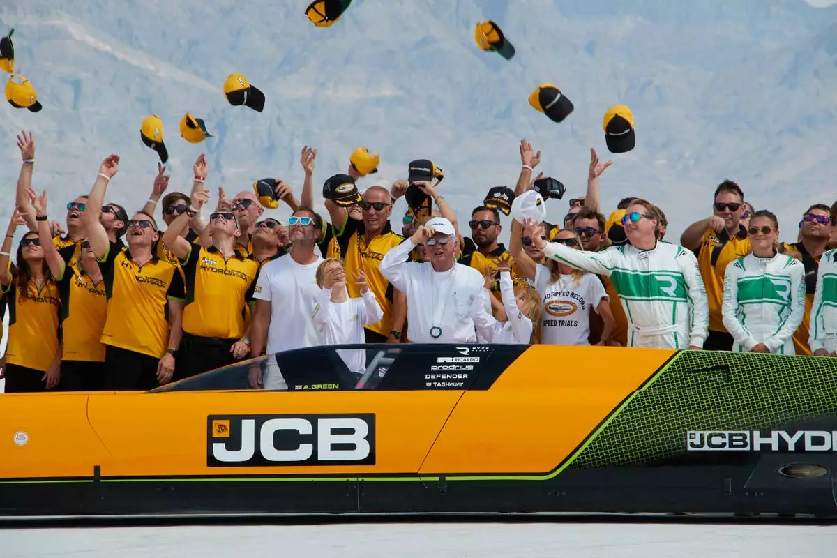 British driver Andy Green, center, and the JCB engineering team celebrate setting a new land speed record for a hydrogen-powered vehicle at the Bonneville Salt Flats in Utah, Tuesday, Aug. 11, 2026. (AP Photo/Hannah Schoenbaum)