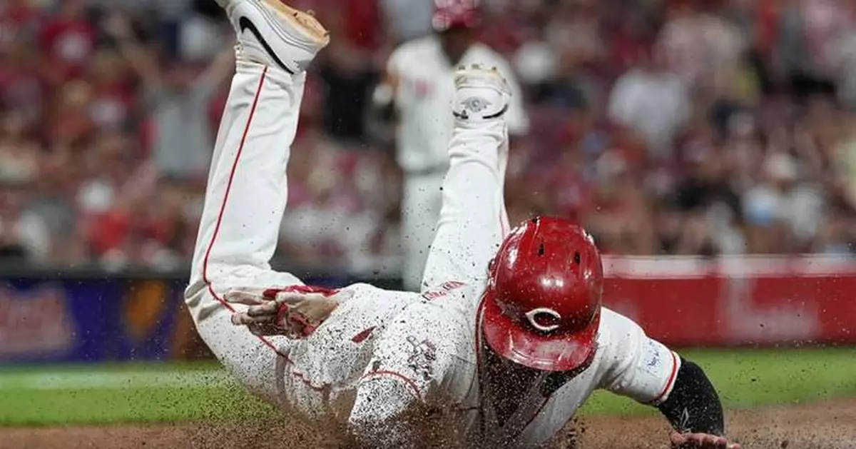 Reds score twice in 8th on wild pitches to beat Athletics 5-4