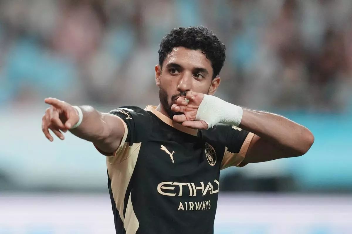 Manchester City's Omar Marmoush celebrates after scoring his side's opening goal during the preseason friendly soccer match between Manchester City and Atletico Madrid in Seoul, South Korea, Sunday, Aug. 9, 2026. (AP Photo/Lee Jin-man)