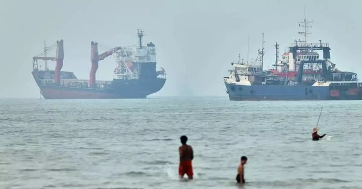 Cargo ship reports being struck in Strait of Hormuz as US, Iran claims about talks diverge