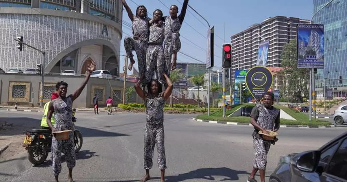 Street acrobats entertain motorists stuck in the Kenyan capital's notorious traffic