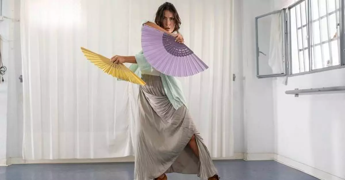 Old-fashioned hand fans make a comeback as Spain swelters, in photos