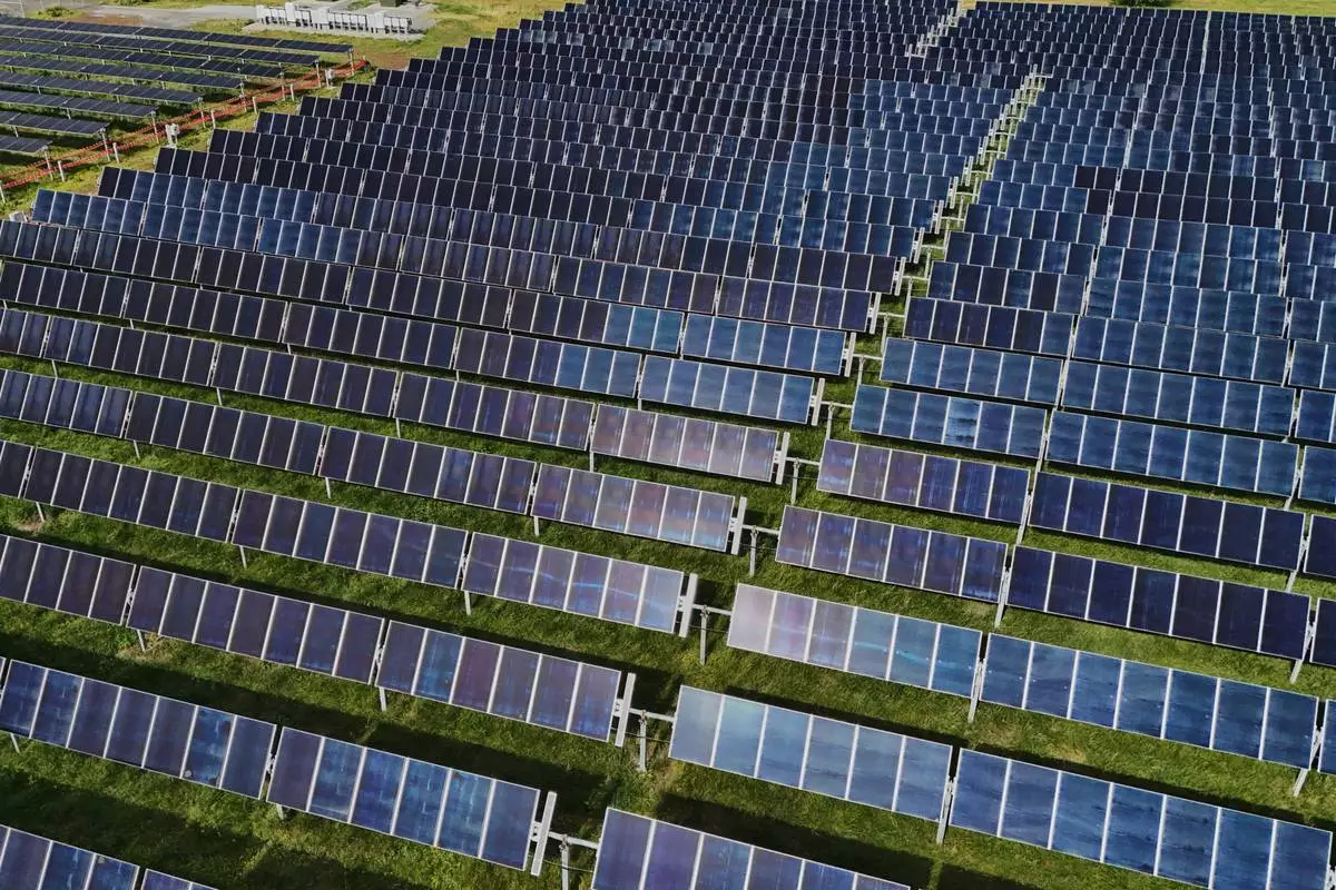 FILE - Solar panels operate, April 28, 2026, at a farm in Christiana, Tenn. (AP Photo/Joshua A. Bickel, File)