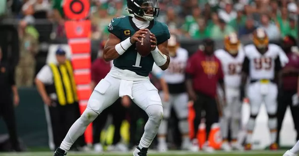 Jalen Hurts throws 3 TD passes and Eagles stuff Commanders' late 2-point try for 24-22 win