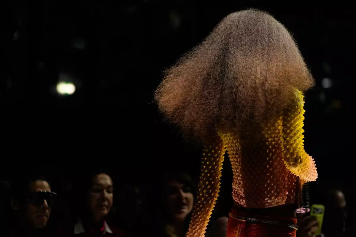 A model wears a creation part of the Roberto Cavalli women's Spring-Summer 2027 collection, presented in Milan, Italy, Thursday, Sept. 24, 2026. (AP Photo/Luca Bruno).