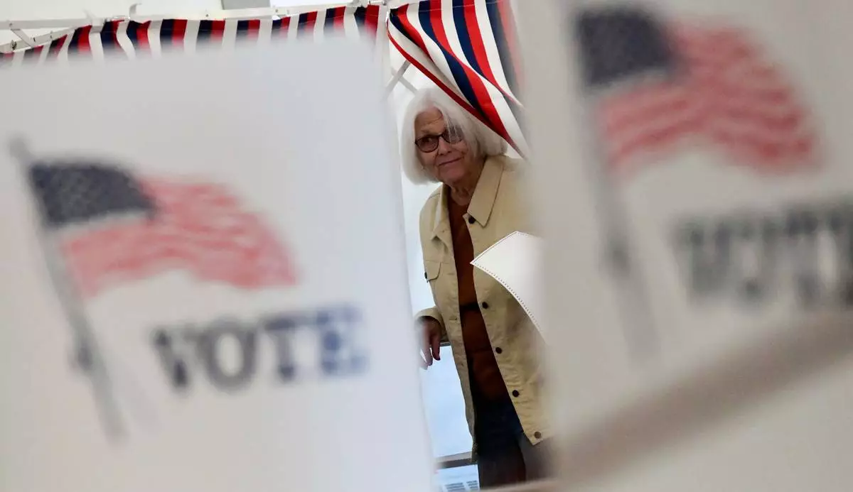 Peggy Jacobs of Chesterfield, N.H., leaves the voting booth in Chesterfield during the New Hampshire State Primaries on Tuesday, Sept. 8, 2026. (Kristopher Radder/The Brattleboro Reformer via AP)