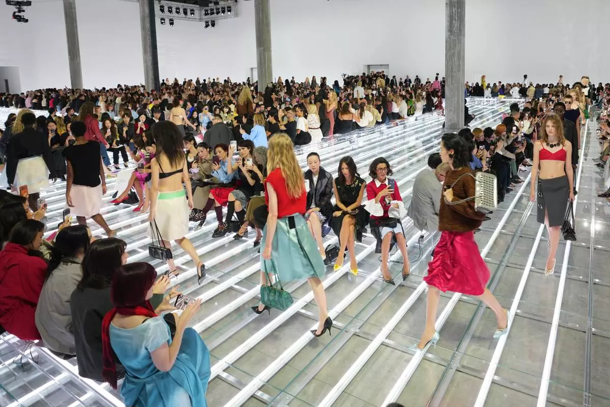 Models wear creations part of the Prada women's Spring-Summer 2027 collection presented in Milan, Italy, Tuesday, Sept. 22, 2026. (AP Photo/Luca Bruno).