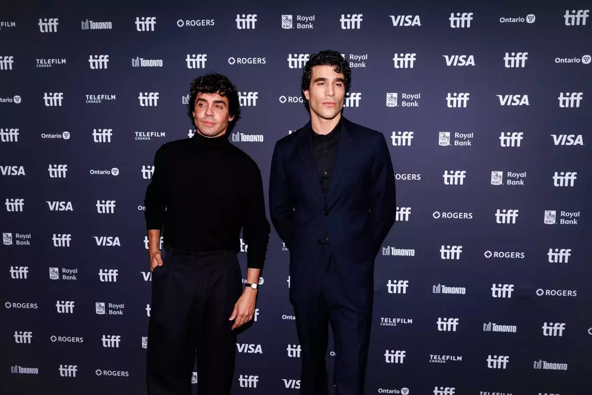 CORRECTION -Javier Ambrossi, left, and Javier Calvo is photographed on the red carpet for the film "La Bola Negra" during the Toronto International Film Festival in Toronto, on Tuesday, Sept. 15, 2026. (Keito Newman/The Canadian Press via AP) CORRECTION: Corrects to Javier Ambrossi instead of Jvier Ambroisa.