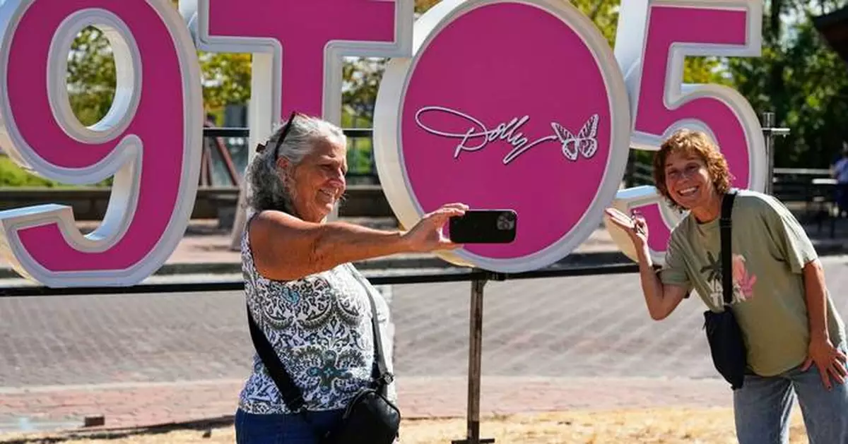It's officially Dolly Parton Day, with parades, pink lights and book drives