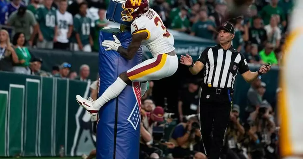 Stefon Diggs hugs the goalpost and gets flagged for costly penalty in Commanders' loss to Eagles