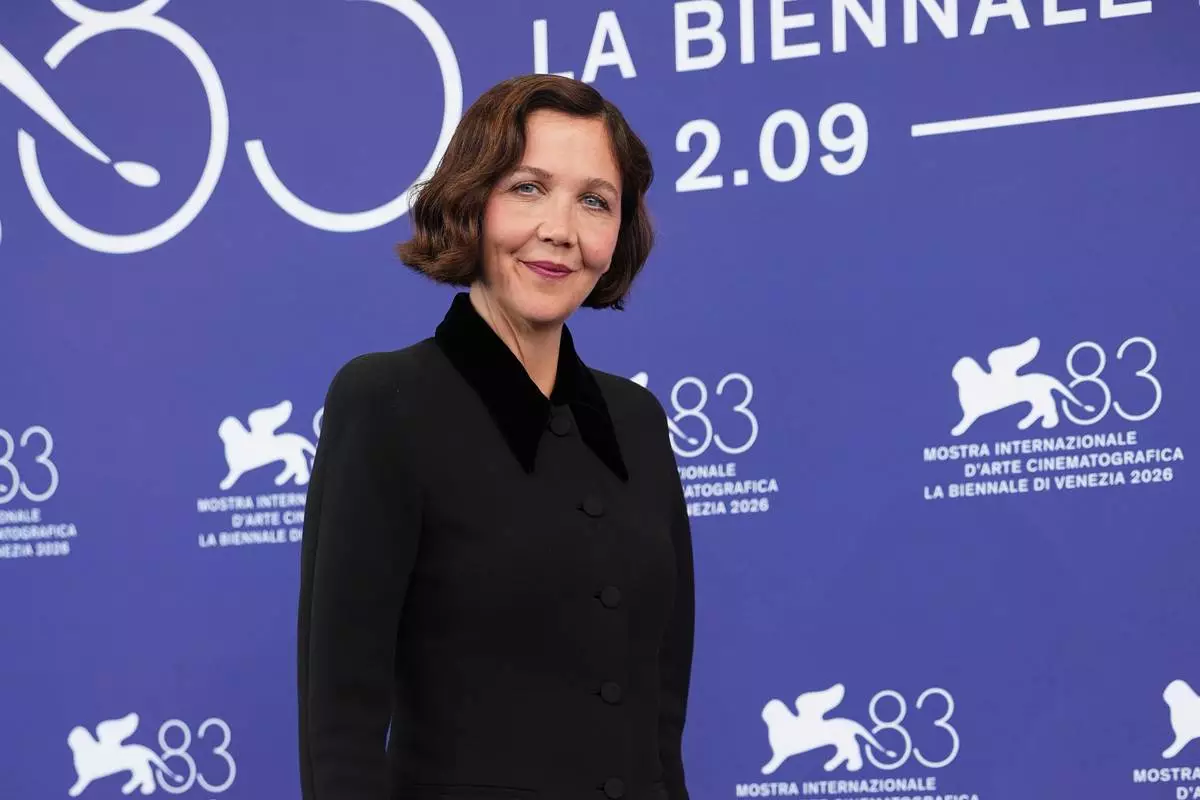 Jury president Maggie Gyllenhaal poses for photographers at the jury photo call during the 83rd edition of the Venice Film Festival in Venice, Italy, on Wednesday, Sept. 2, 2026. (Photo by Scott A Garfitt/Invision/AP)